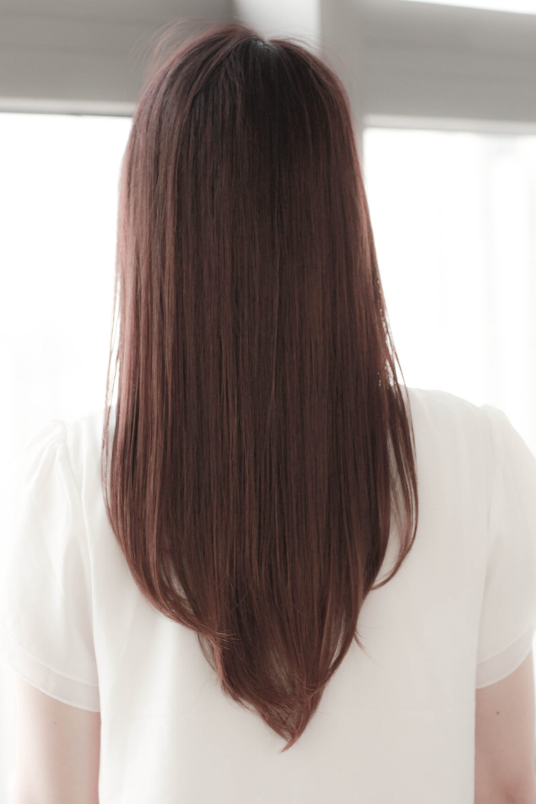 アプリコットオレンジ×内巻きワンカールのストレートロングヘア